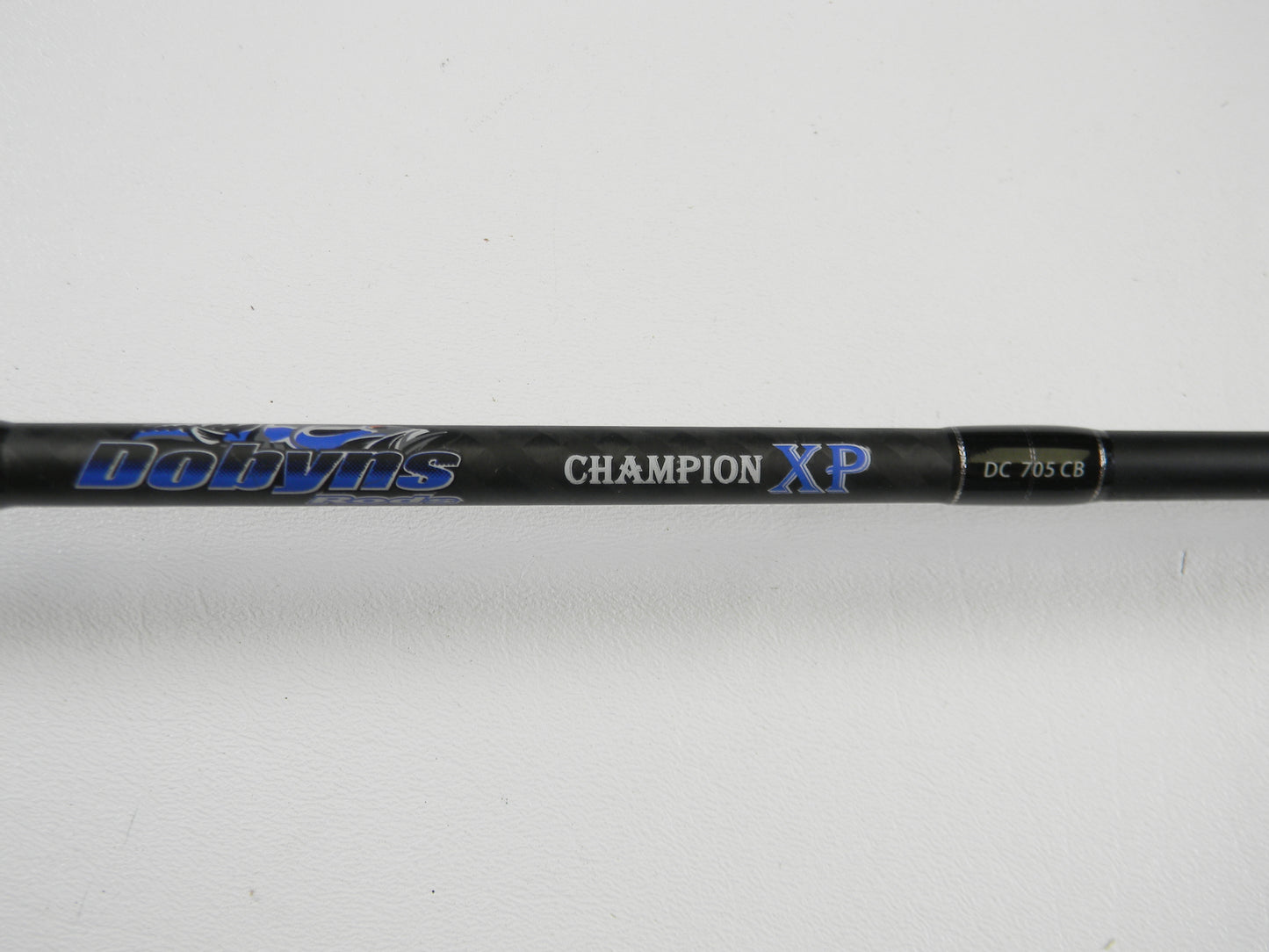 A close-up of the Dobyns Champion XP DC705CB 7'0" Medium Heavy Used Casting Rod in excellent condition—ideal for upgrading through our Rod and Reel Trade-In Program or earning store credit with your used gear.