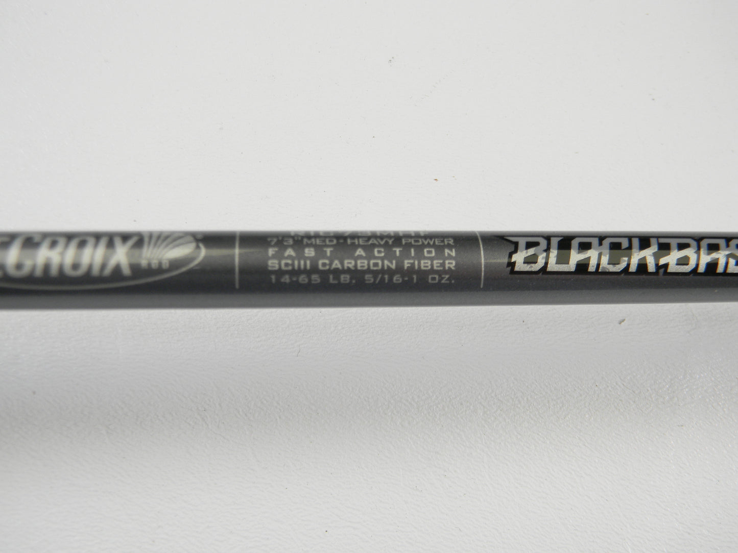 Close-up of a St. Croix Black Bass RIC73MHF 7'3" Medium Heavy Used Casting Rod—fast action, SCIII carbon fiber, 14-65 lb, 5/16-1 oz, excellent condition. Part of our Rod and Reel Trade-In Program for quality used gear seekers.