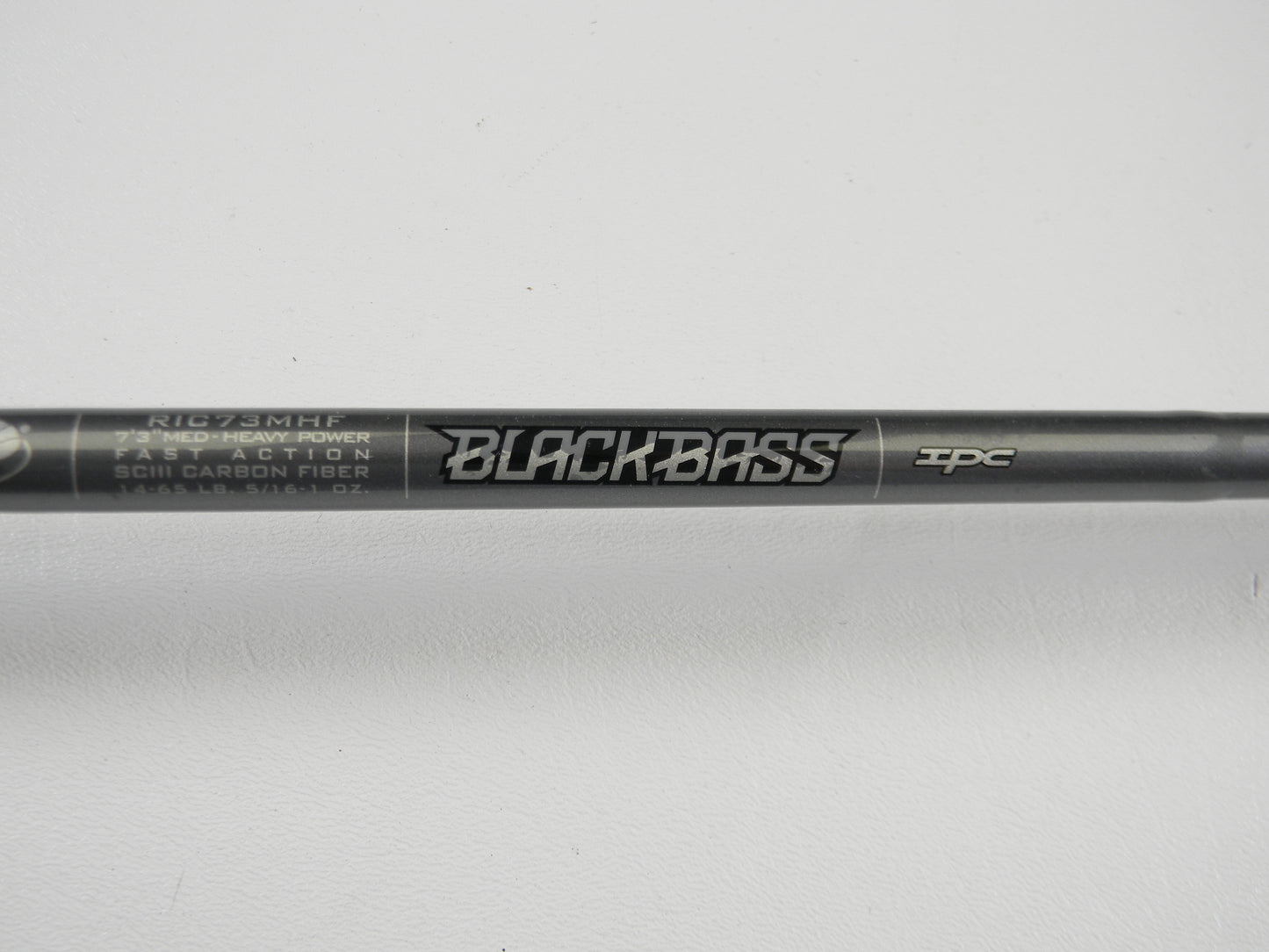 Close-up of a St. Croix Black Bass RIC73MHF 7'3" Medium Heavy Used Casting Rod in excellent condition on a white background—an ideal choice for upgrading your gear through our Rod and Reel Trade-In Program.