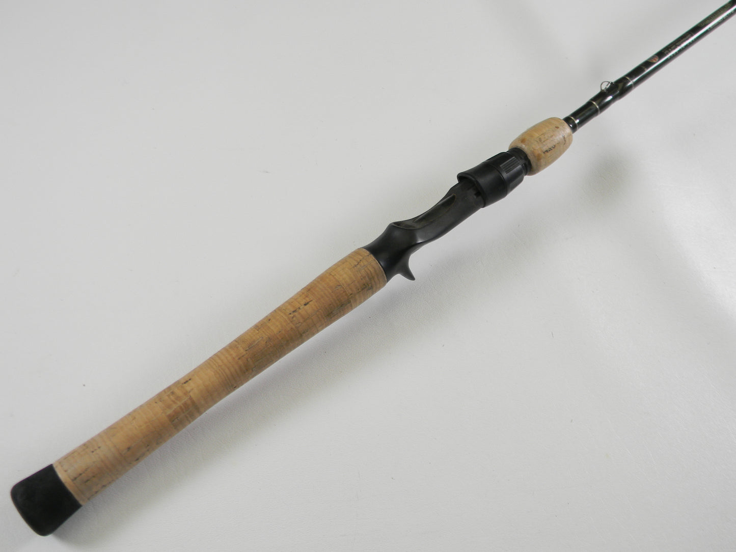 A close-up of the St. Croix Legend Elite EC68MHF 6'8" Medium Heavy casting rod handle—used, very good condition—against a white background, ideal for customers trading in gear for store credit through our Rod and Reel Trade-In Program.