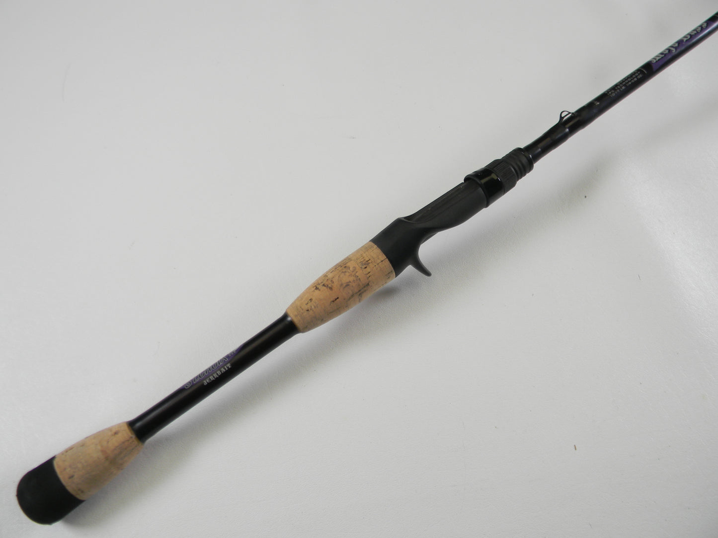 The St. Croix Mojo Bass MJC68MF Jerkbait 6'8" Medium casting rod, in very good condition, features a black design with a cork handle and trigger grip reel seat for right-handers. Ideal for casting, this rod can be paired with our store credit options for your next upgrade.
