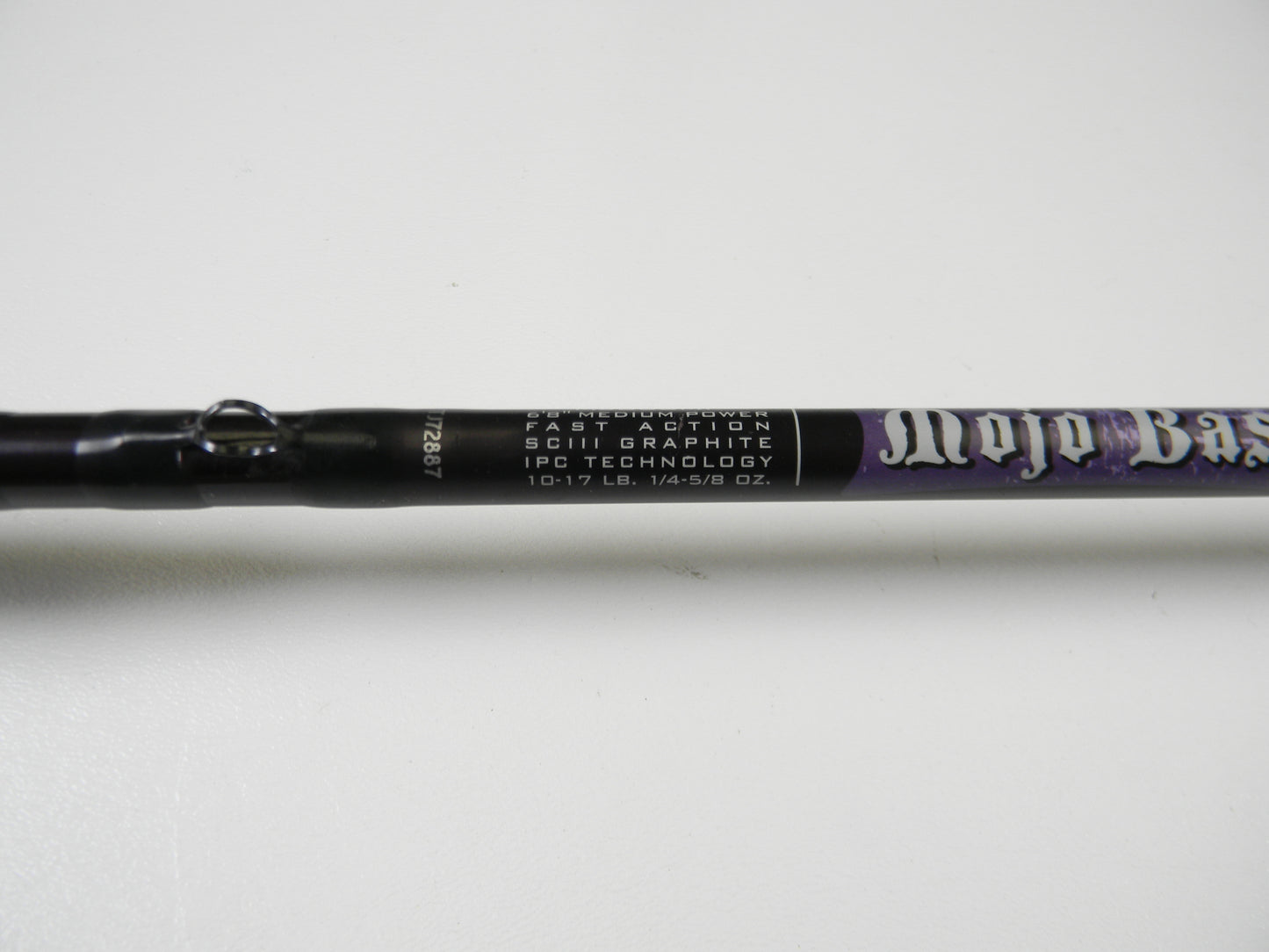 Close-up of a St. Croix Mojo Bass MJC68MF Jerkbait rod shows "Fast Action SCIII Graphite," "IPC Technology," and weight specs "10-17 LB. 1/4-5/8 OZ." The handle is partially visible, making it ideal for trade-in or store credit opportunities.