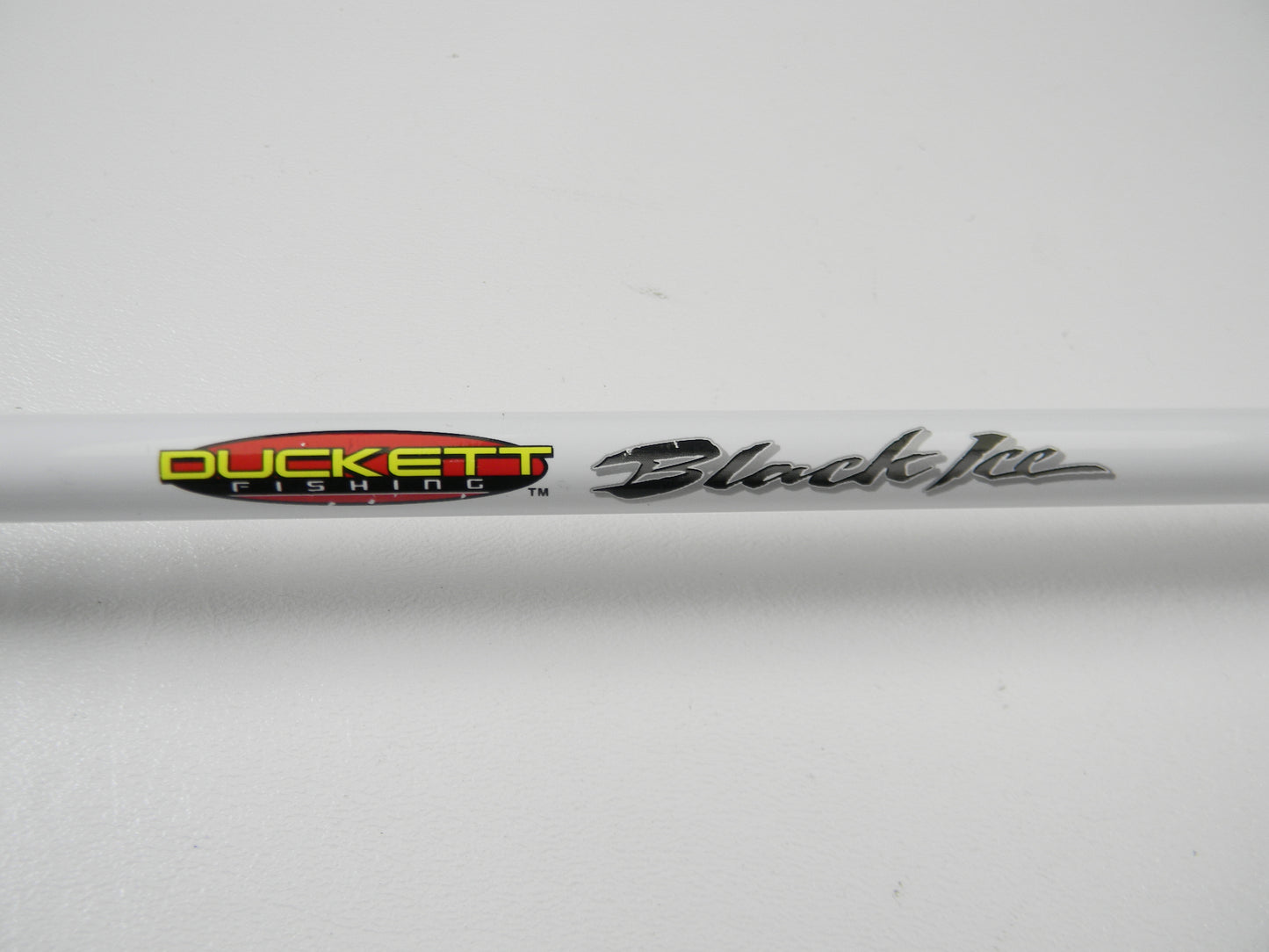 Upgrade with our Rod and Reel Trade-In Program by choosing the Duckett Black Ice DFBI80MH-CC, an 8'0" Medium Heavy Crankin' casting rod in excellent condition. Featuring "DUCKETT fishing" in red/yellow and "Black Ice" in silver on a white background, it's a wise use of store credit.