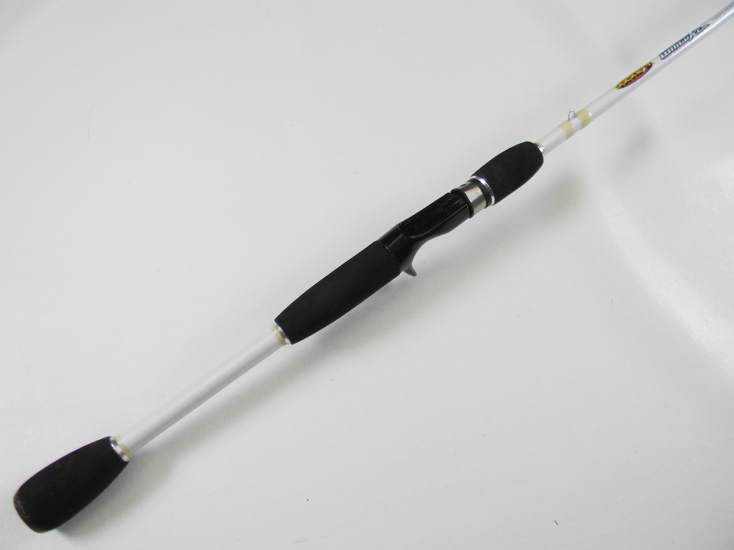The Duckett White Ice DFWI70MCC Timmy Horton 7'0" Medium Crankin' is a white casting rod with black grips and reel seat, ideal for upgrades through our Rod and Reel Trade-In Program.