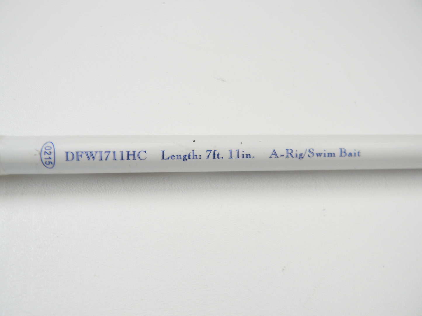 A close-up of the 7'11" Duckett White Ice DFWI711HC Byron Velvick rod, ideal for A-Rig/Swimbait. The "00715" indicates it's used. Trade it in through the Nation's Best Rod and Reel Trade-In Program for store credit.