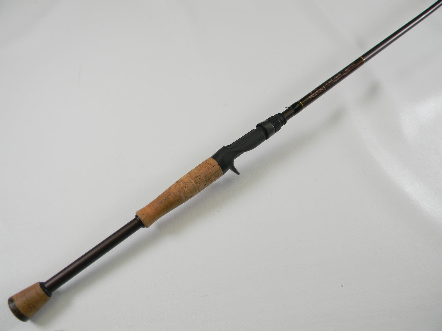 The Falcon Lowrider LFC-72HH Flippin Stik 7'2" heavy casting rod features a brown cork handle and black reel seat on a plain white background. Ideal for quality used gear seekers, it's diagonally framed and perfect for our Rod and Reel Trade-In Program to earn store credit.