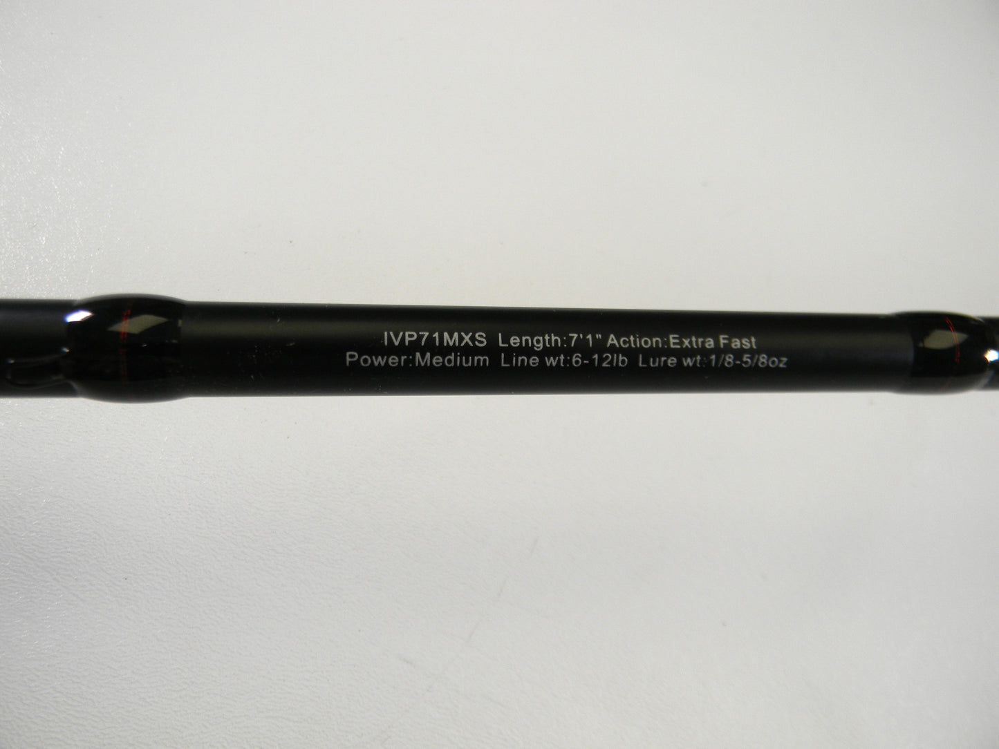 The Ark Fishing Invoker Pro IVP71MXS 7'1" Medium spinning rod in excellent used condition is featured in a close-up, highlighting its extra fast action and specifications (Line wt: 6-12lb, Lure wt: 1/8-5/8oz) against a pristine white backdrop from our Rod and Reel Trade-In Program.