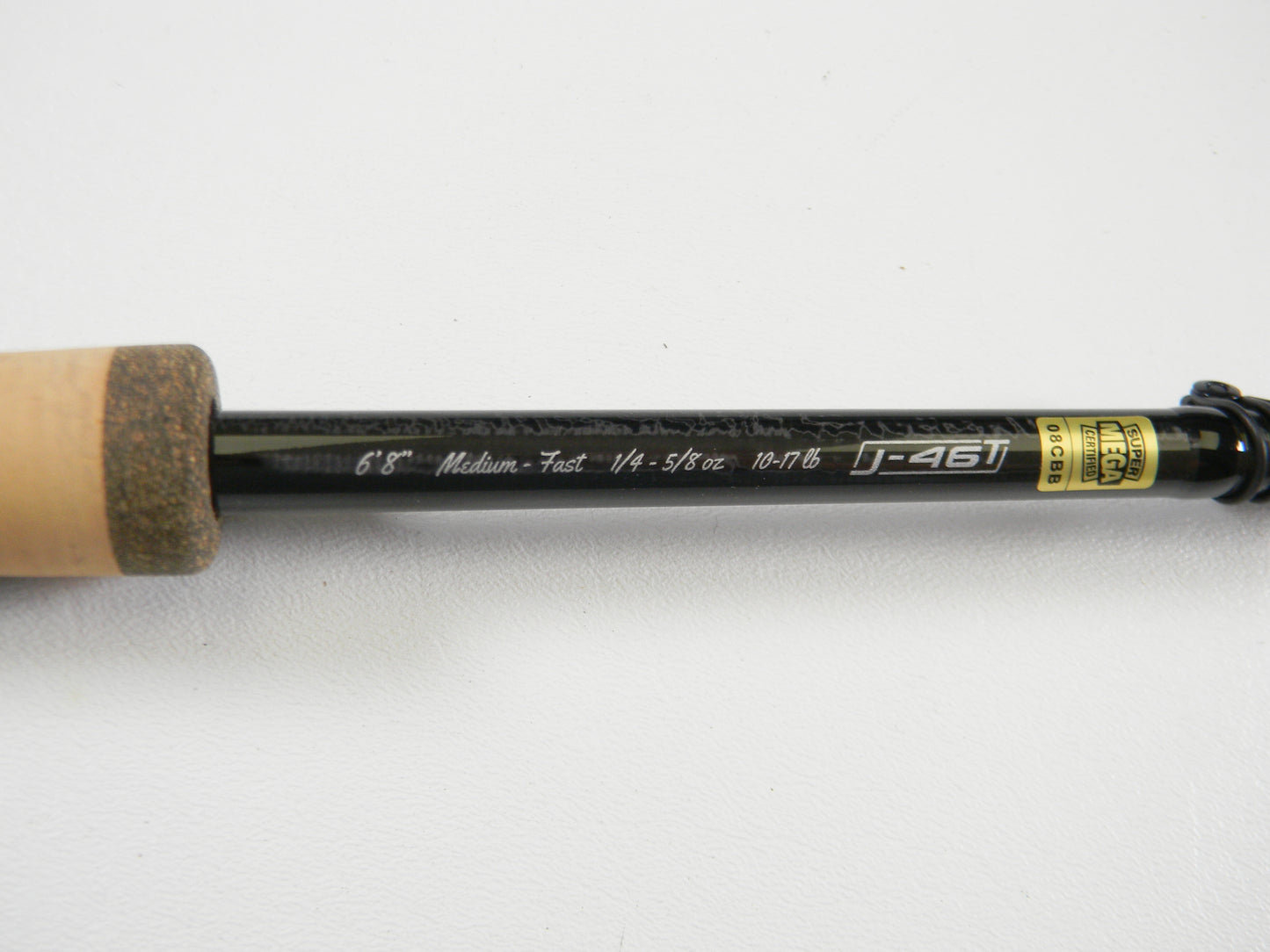 Close-up of 13 Fishing Envy Black 3 EB3C68M 6'8" medium casting rod in excellent used condition, specs visible. Trade in your gear at Nation's Best Rod and Reel Trade-In Program for store credit. Part of the cork grip is shown.