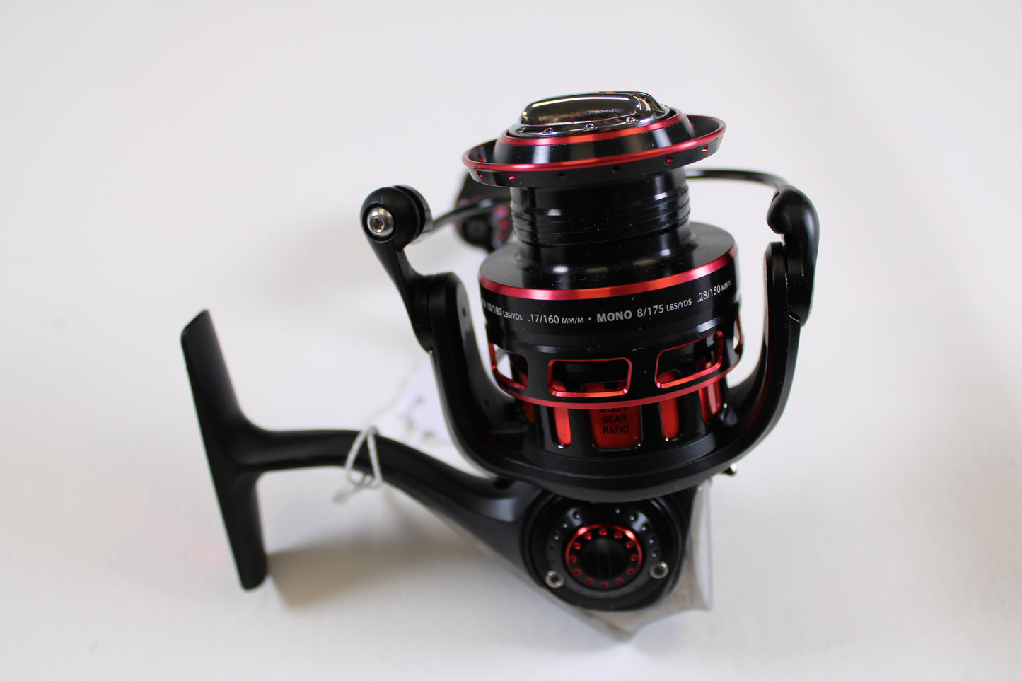 A used Abu Garcia Revo SX Gen 2 REVO2SX30 6.2:1 spinning reel in black and red with metallic accents is shown on a white background. Trade in your old gear for store credit through our Rod and Reel Trade-In Program.