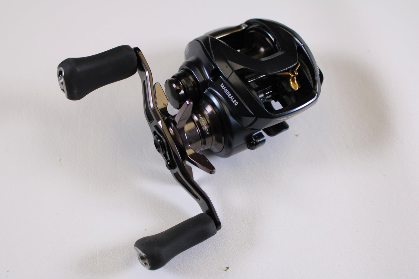 A close-up of the Daiwa Steez A 100 STZ100XH 8.5:1 RH used casting reel in very good condition—ideal for upgrading with our Rod and Reel Trade-In Program or earning store credit for your used Daiwa gear.