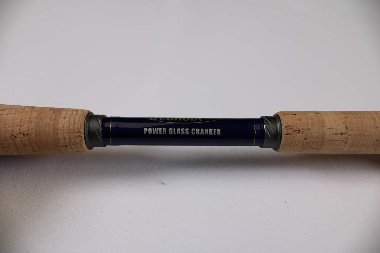 A close-up of the St. Croix Legend Tournament Bass LBTC74MHM Power Glass Cranker 7'4" Medium Heavy used casting rod with cork grips—eligible for our Rod and Reel Trade-In Program for store credit on excellent condition gear.