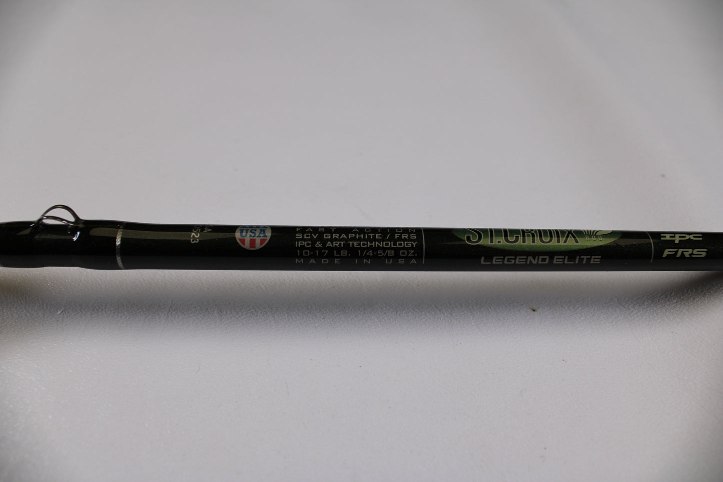 A close-up of a used St. Croix Legend Elite EC70MF 7'0" Medium casting rod in excellent condition shows details like "SCV graphite/FRS" and "10-17 LB, 1/4-5/8 OZ." Eligible for our Rod and Reel Trade-In Program for store credit.