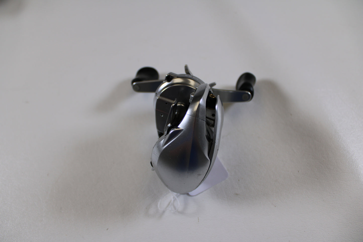 A Shimano Metanium MGL 150 XG 8.5:1 Used Casting Reel in good condition is shown on a plain white background—an ideal upgrade through our Rod and Reel Trade-In Program to earn store credit for your used gear.