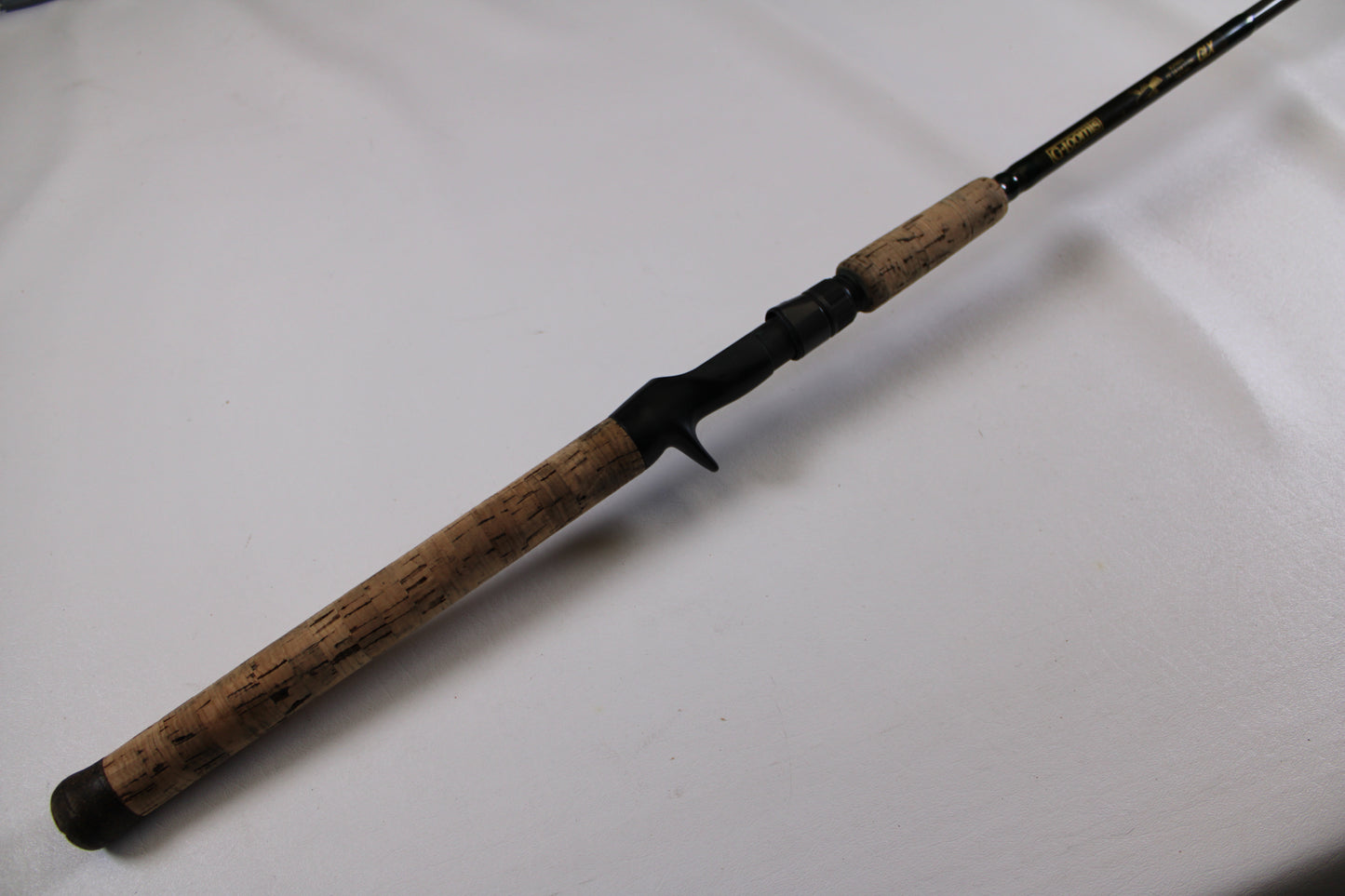 A G. Loomis BCFR894 GLX Casting Rod in good used condition, shown close-up with cork handle and black reel seat—ideal for upgrading through our rod and reel trade-in program to earn store credit on used gear.