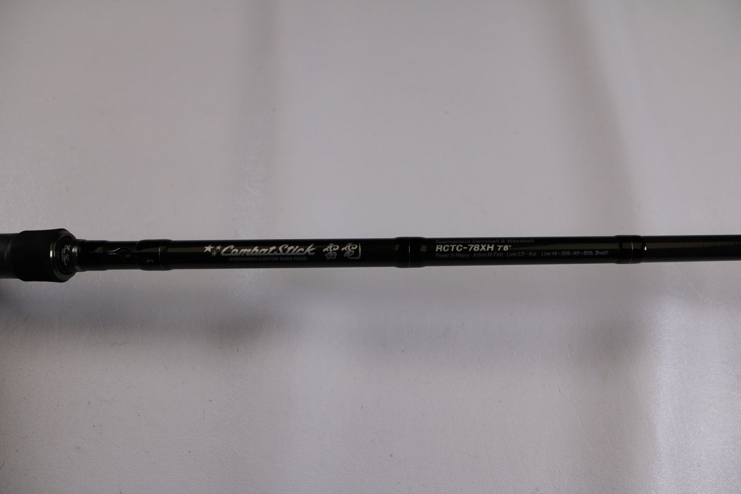 A close-up of an Evergreen Combat Stick RCTC-78XH Used Casting Rod in excellent condition, ideal for the Rod and Reel Trade-In Program or adding to your used gear collection. The black rod is set against a plain white background.