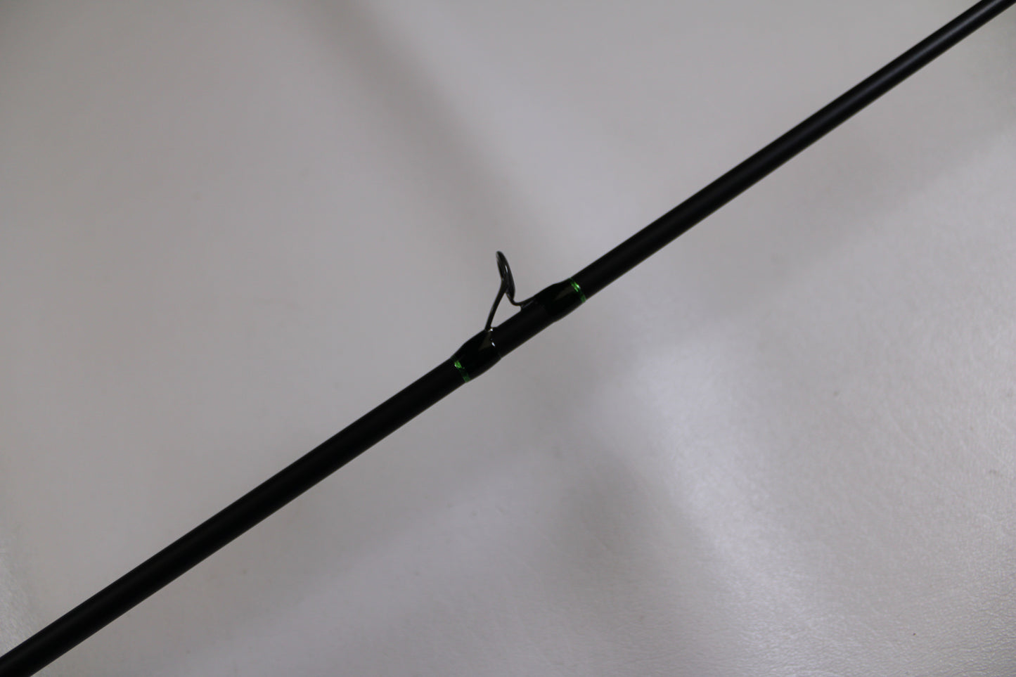 A close-up of the G. Loomis IMX-PRO 782c MBR 6'6" Medium Used Casting Rod in excellent condition, set against a light background—perfect for assessing quality at our Rod and Reel Trade-In event.