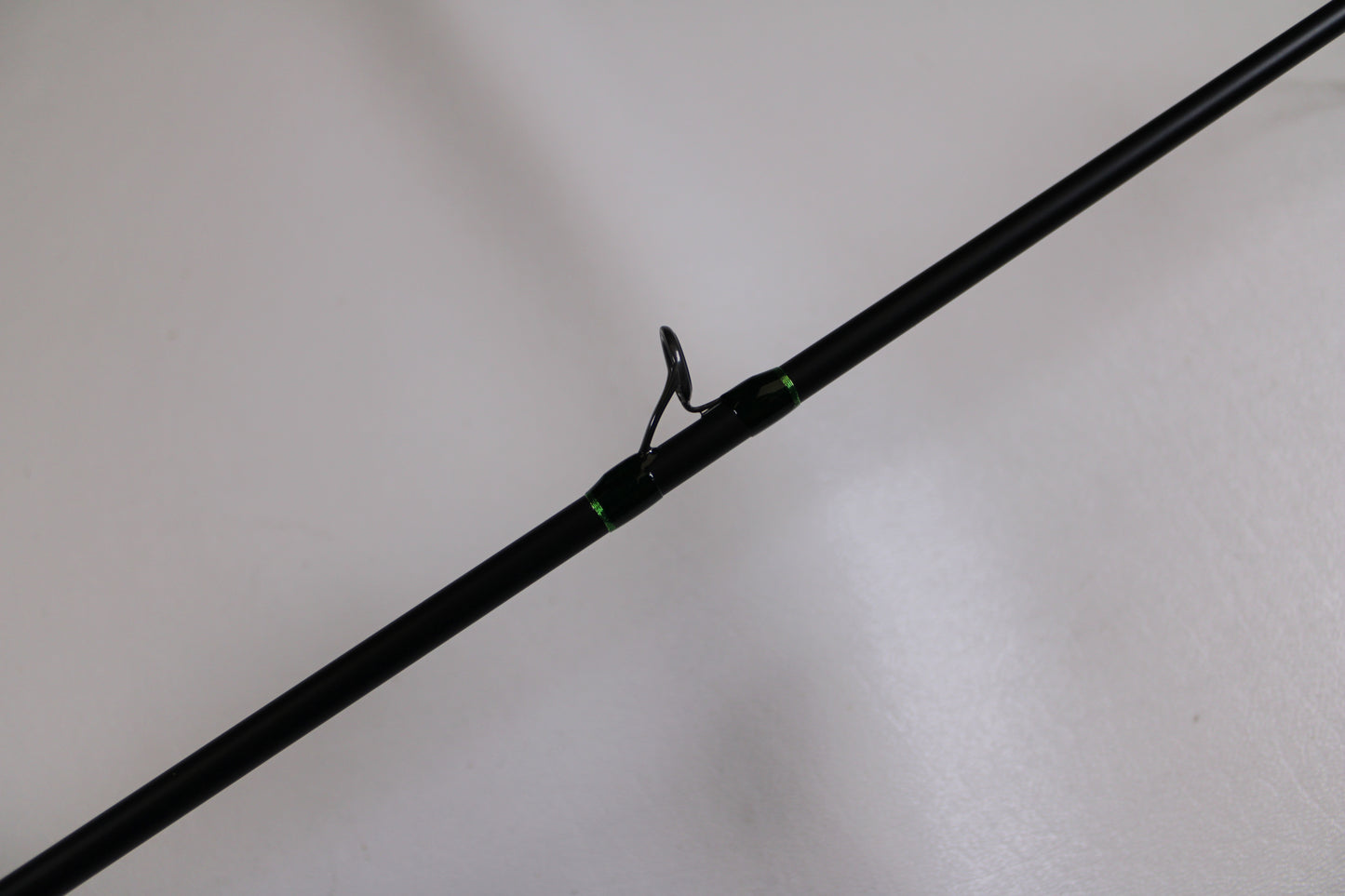 A close-up of the G. Loomis IMX-Pro 783C CBR Used Casting Rod in excellent condition, featuring a metal guide ring—ideal for buyers seeking used G. Loomis gear or participating in the Rod and Reel Trade-In Program for store credit.