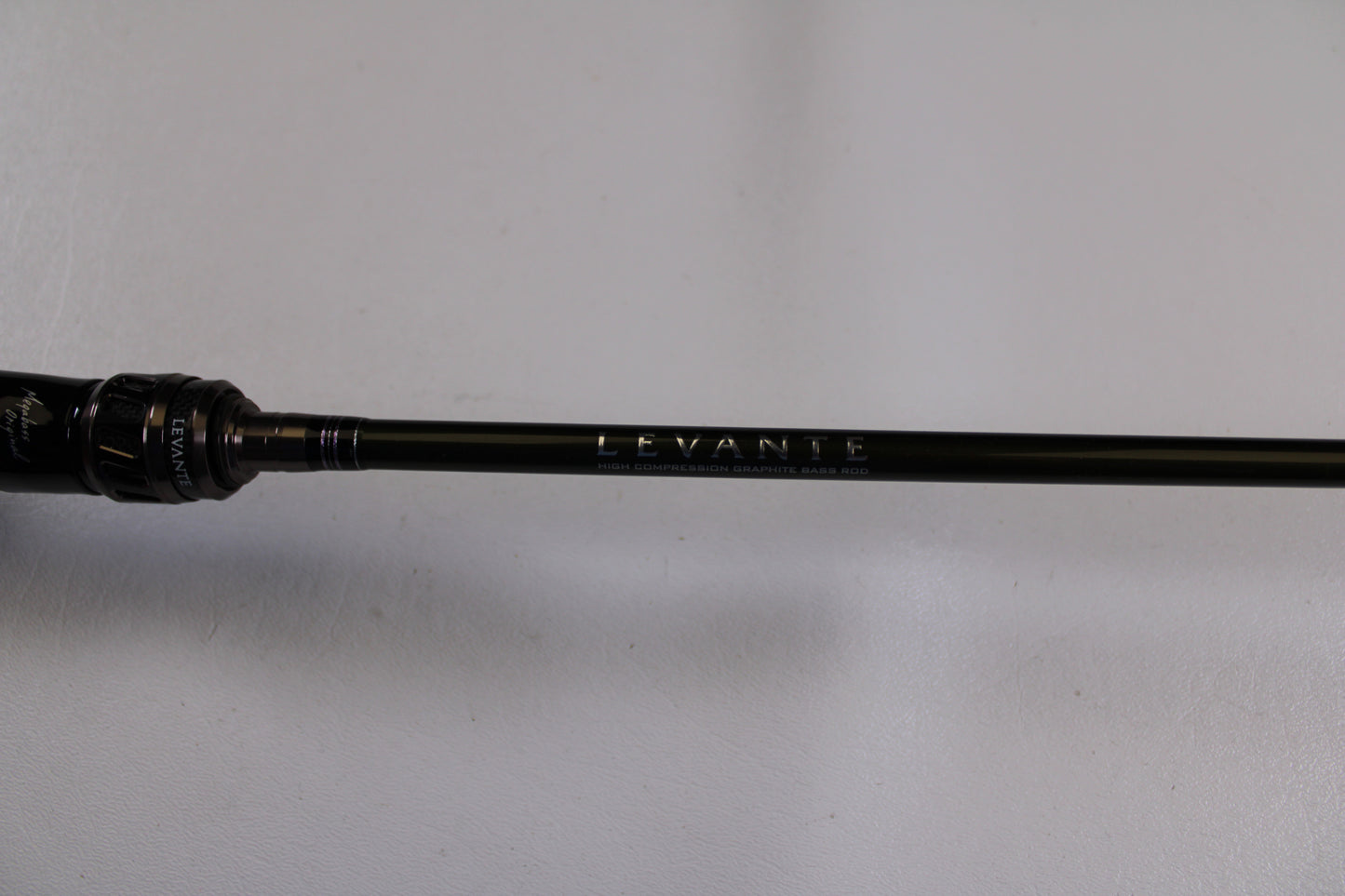 A close-up of the Megabass Levante F3-66LV Used Casting Rod in excellent condition, featuring "LEVANTE" on the shaft—ideal for those interested in quality used gear from our Rod and Reel Trade-In program.