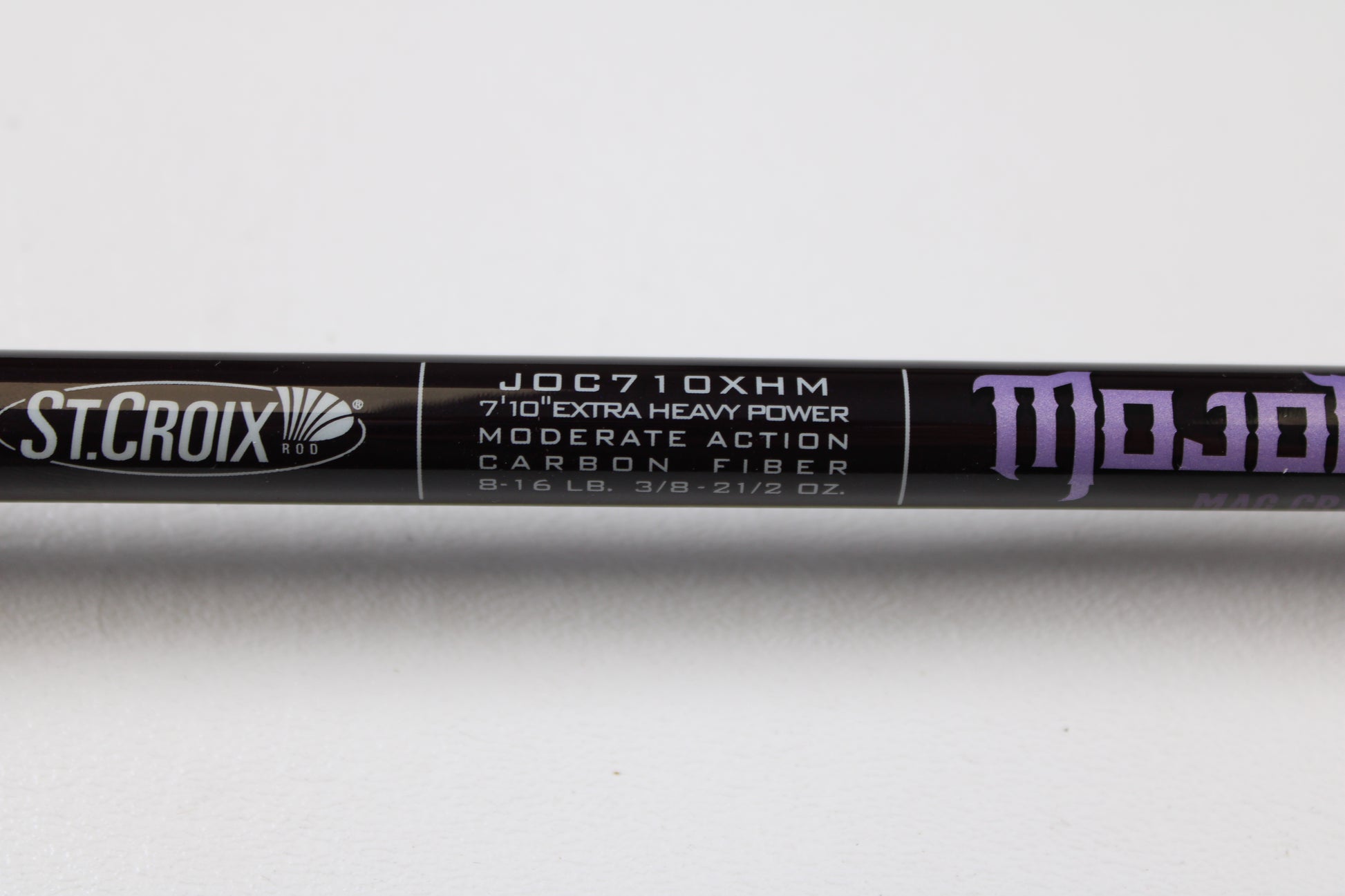 Close-up of a used St. Croix Mojo Bass JOC710XHM Mag Cranker 7'10" XH casting rod in mint condition—eligible for our Rod and Reel Trade-In Program or store credit.