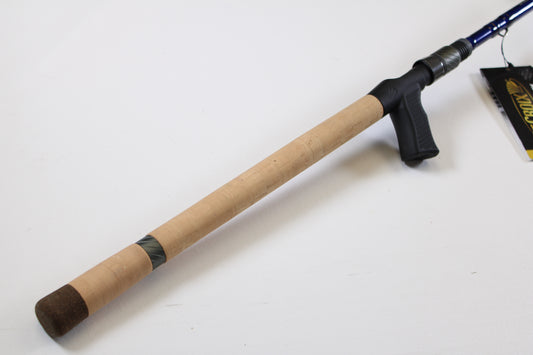 A St. Croix Legend Tournament Bass LBTC710XHF 7'10" XH used casting rod with a light wood grip, dark butt cap, and black reel seat and trigger rests on a white surface—ideal for our Rod and Reel Trade-In Program for store credit.