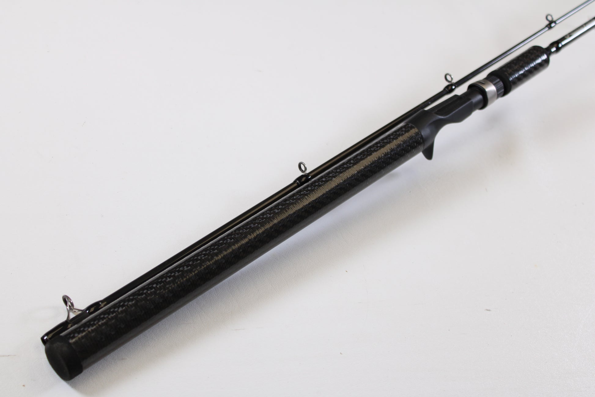 Showcase your used Lamiglas X11 Graphite Handle LX86MCGH 8'6" Medium 2 Piece Casting Rod—Excellent Condition—ideal for our rod and reel trade-in program. Features include a graphite handle and metal guides, set against a white background.