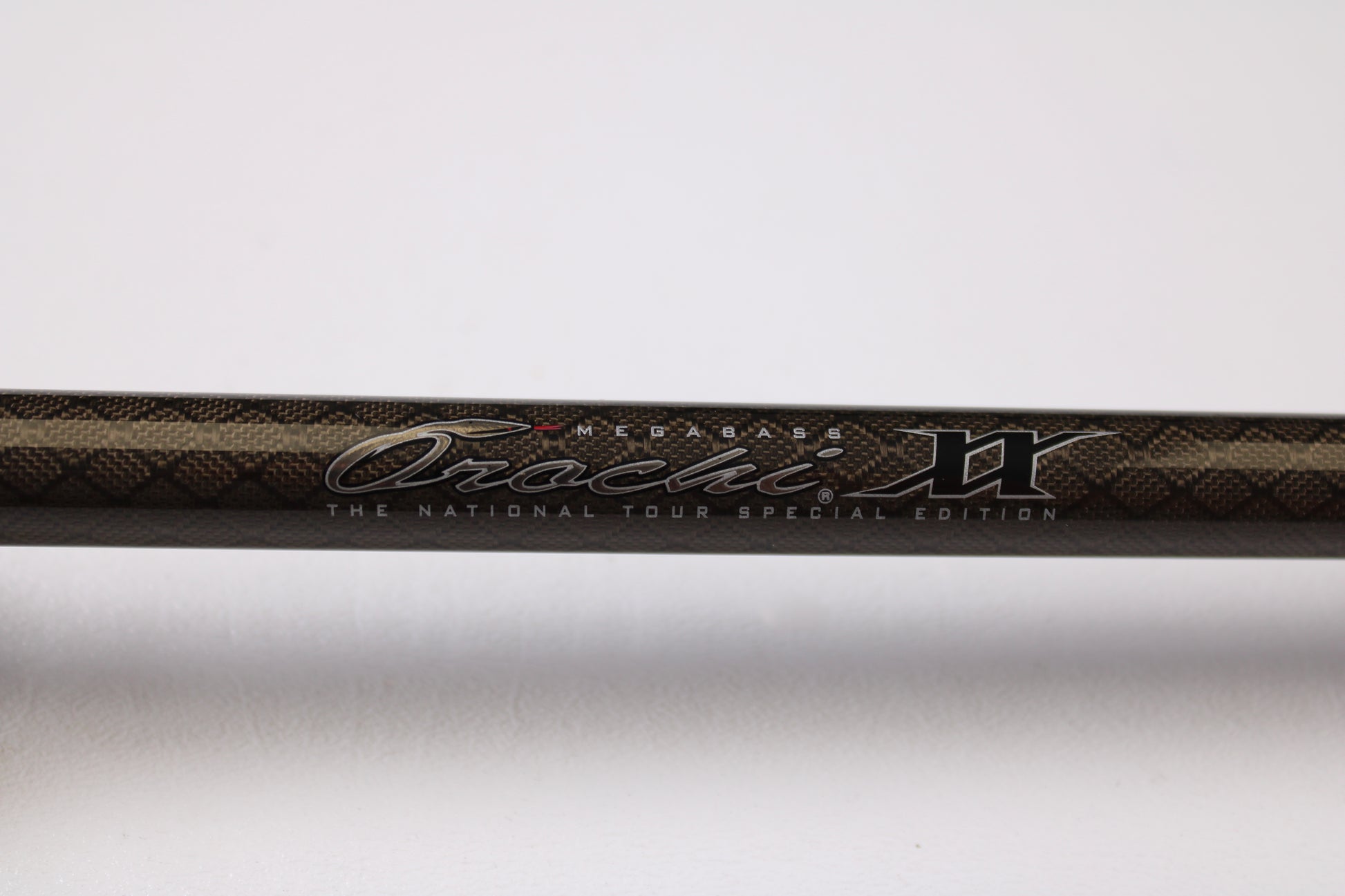 Close-up of a Megabass Orochi XX F6-711XXG Launcher 7'11" Used Casting Rod in excellent condition, ideal for anglers seeking quality pre-owned gear or looking to trade in rods and reels for store credit.