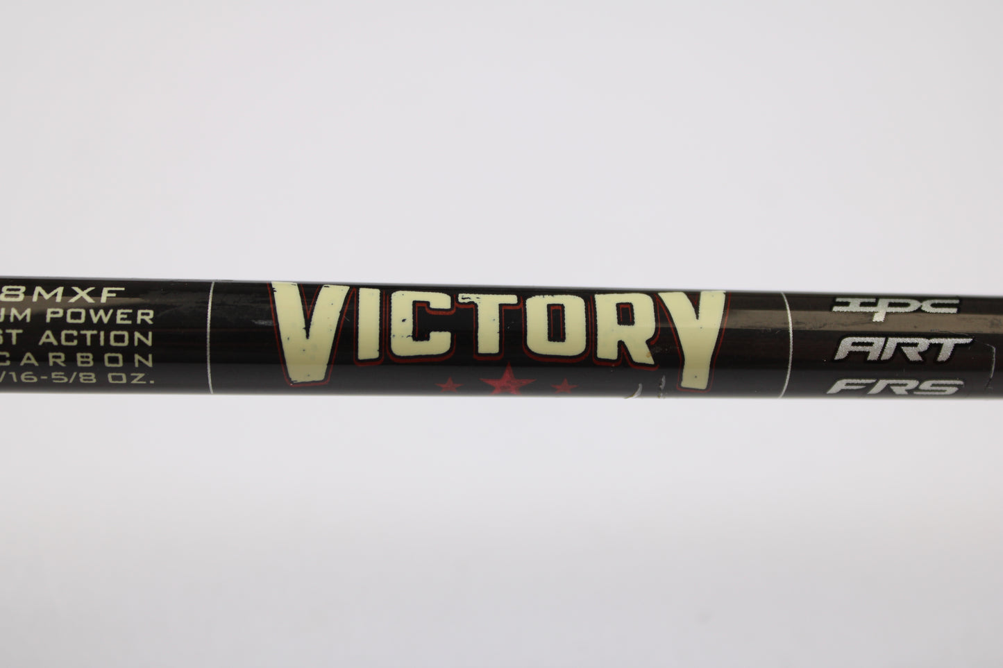 Close-up of a St. Croix Victory VTS68MXF Tactical 6'8" Medium Used Spinning Rod in excellent condition, black and labeled "VICTORY" in bold yellow. Ideal for those looking to trade in gear with our Rod and Reel Trade-In Program.