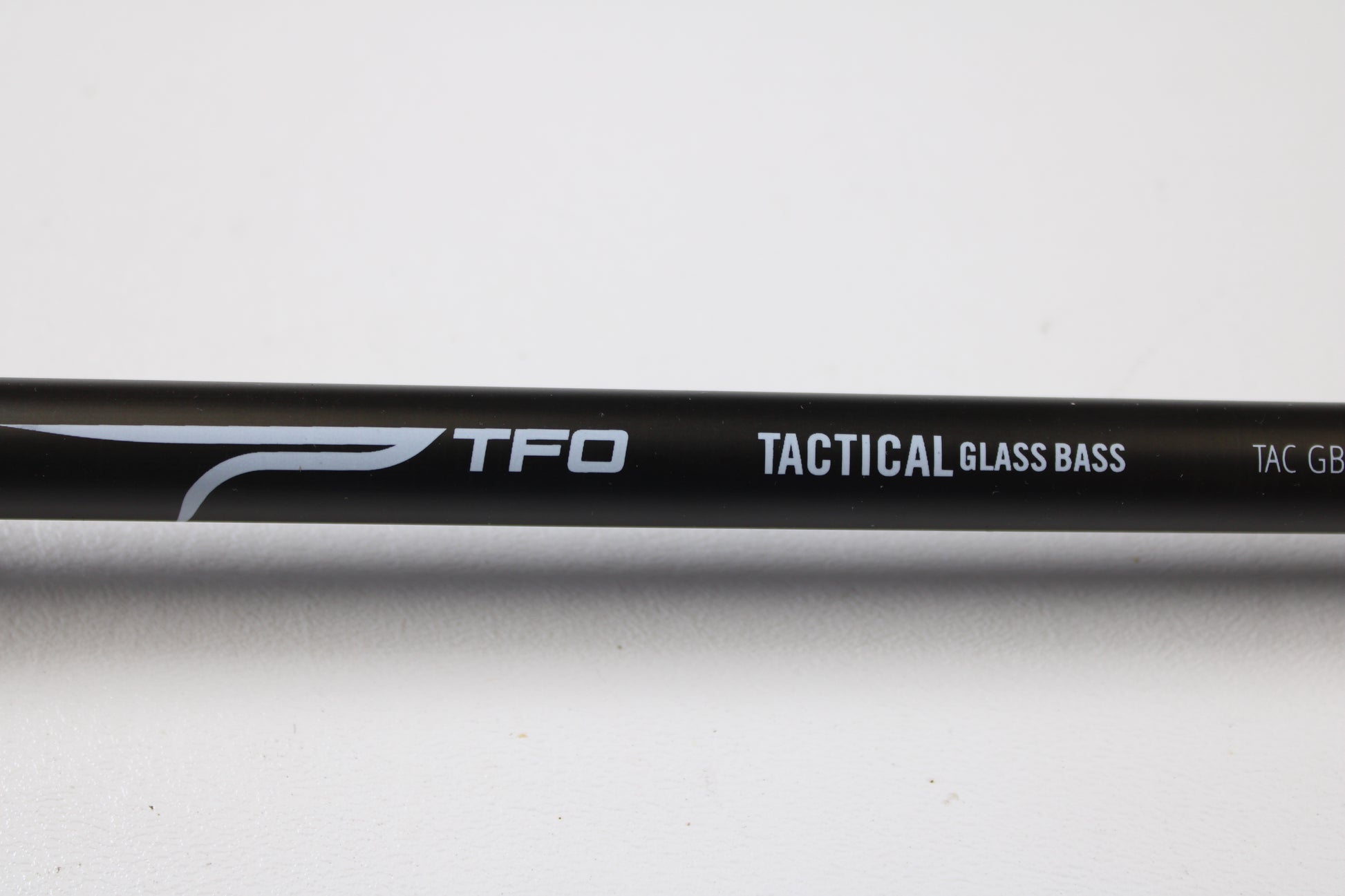 A close-up of the Temple Fork TFO Tactical Glass Bass TACGBCB745-1 7'4" Medium Heavy used casting rod in excellent condition. Trade in your gear for store credit with our Rod and Reel Trade-In Program.