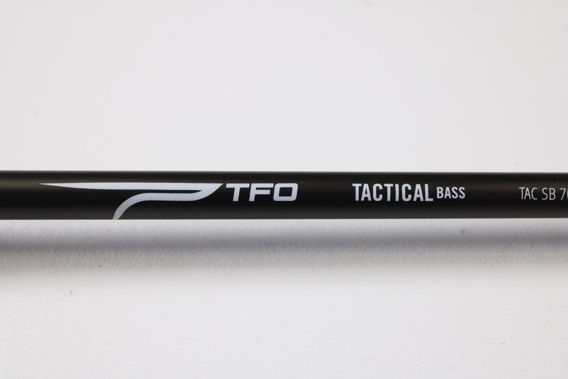Close-up of a Temple Fork TFO Tactical Bass TACSB7051-3 7'0" Medium Heavy Used Casting Rod in excellent condition—ideal for our Rod and Reel Trade-In Program if you're looking to upgrade your fishing gear.