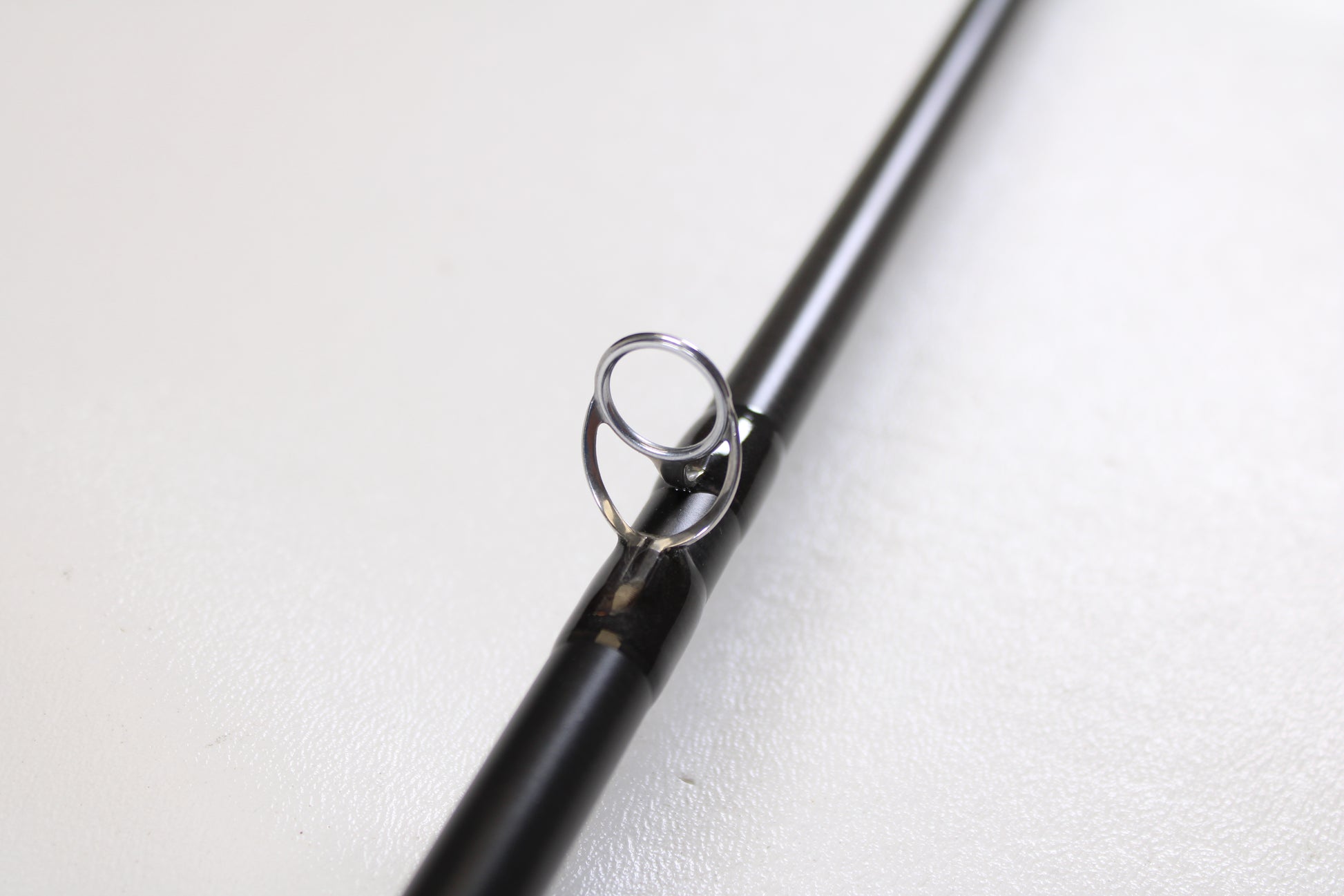 A close-up of the Temple Fork TFO Tactical Bass TACSB7051-3 7'0" Medium Heavy Used Casting Rod in excellent condition—ideal for those exploring our Rod and Reel Trade-In Program or seeking quality pre-owned gear.