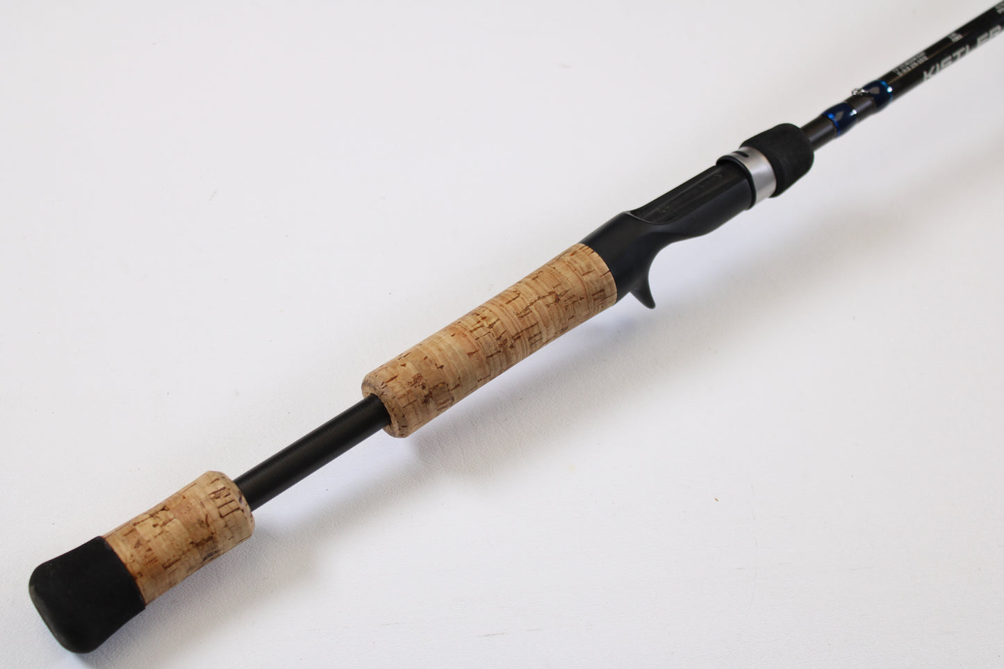A close-up of the Kistler Helium HE703LMH 7'0" Lite Medium Heavy Used Casting Rod in excellent condition, perfect for those interested in our Rod and Reel Trade-In Program for quality used Kistler gear.