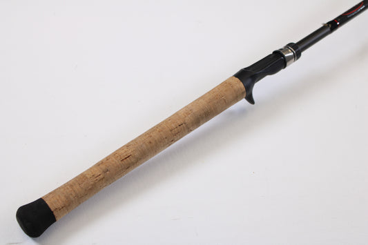 A close-up of the Kistler KFGS73 Frog and Slop Special 7'3" Heavy Used Casting Rod handle—featuring a cork grip and black reel seat—ideal for customers interested in our Rod and Reel Trade-In Program for store credit.