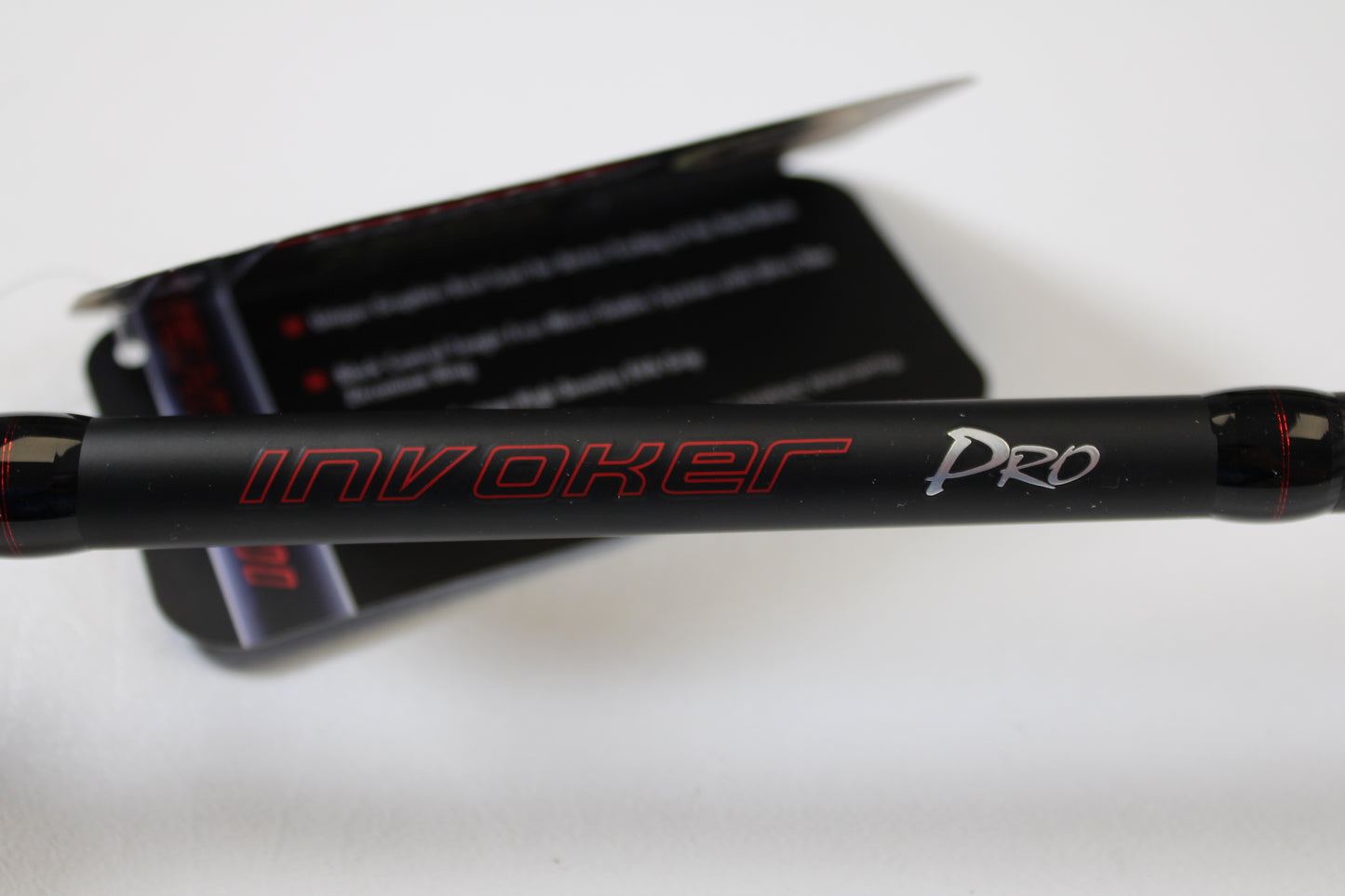 Close-up of a black Ark Fishing Invoker Pro IVP71MXS 7'1" Medium spinning rod in excellent used condition, labeled in red and white, ideal for anglers seeking store credit or trade-in on used rods and reels.