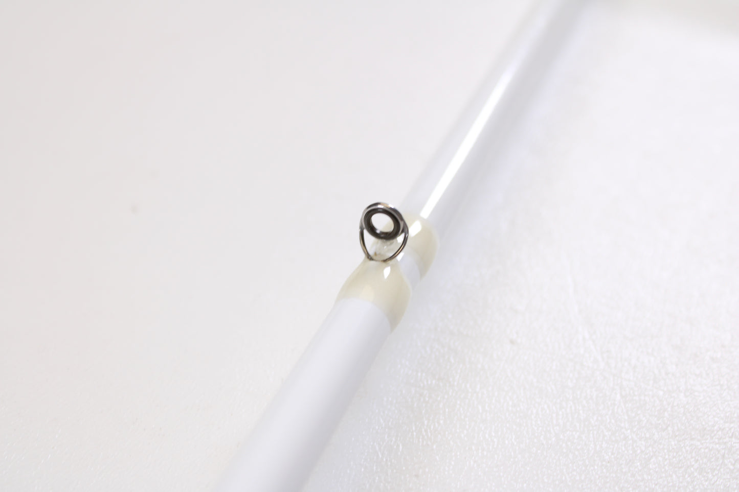 Close-up of a Duckett Pro Series DFPS74H-C Chris Lane 7'4" Heavy used casting rod in excellent condition, highlighting a single metal line guide with light wrap—ideal for anglers seeking quality pre-owned gear or considering a trade-in.