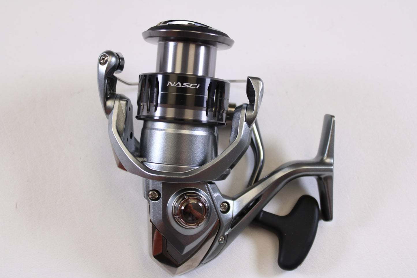 A close-up of a Shimano Nasci FC NAS4000XGFC 6.2:1 Used Spinning Reel in excellent condition—ideal for used gear enthusiasts or those wanting store credit with our Rod and Reel Trade-In Program.
