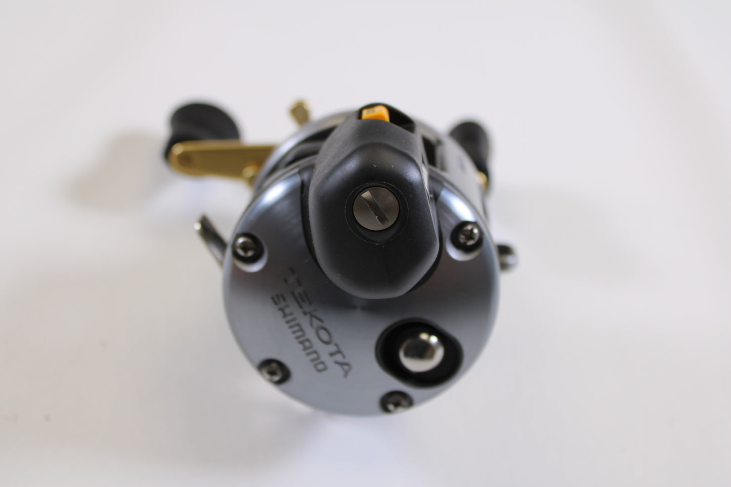 Close-up of a Shimano Tekota Line Counter 300LC TEK-300LC 4.2:1 RH Used Casting Reel in excellent condition, showing detailed front features and brand name—ideal for those interested in trading rods or reels for store credit.