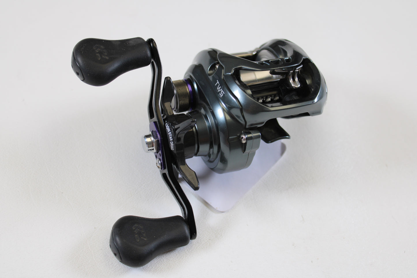 A close-up of the Daiwa Tatula SV TW TTUSV103XS 8.1:1 RH casting reel in good used condition—ideal if you're interested in quality pre-owned gear or our rod and reel trade-in program.