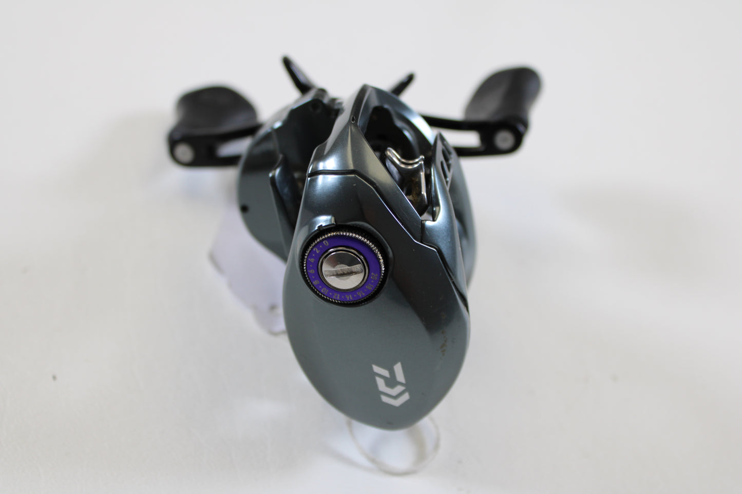 A close-up of a Daiwa Tatula SV TW TTUSV103XS 8.1:1 RH casting reel in good used condition—ideal for our rod and reel trade-in program or to earn store credit on your used Daiwa gear.