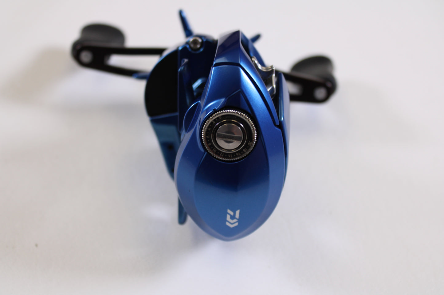 A close-up of the Daiwa Coastal TW 80H CLTW80H 7.1:1 RH Used Casting Reel in excellent condition, photographed from above—ideal for anyone interested in quality used gear or our trade-in program.
