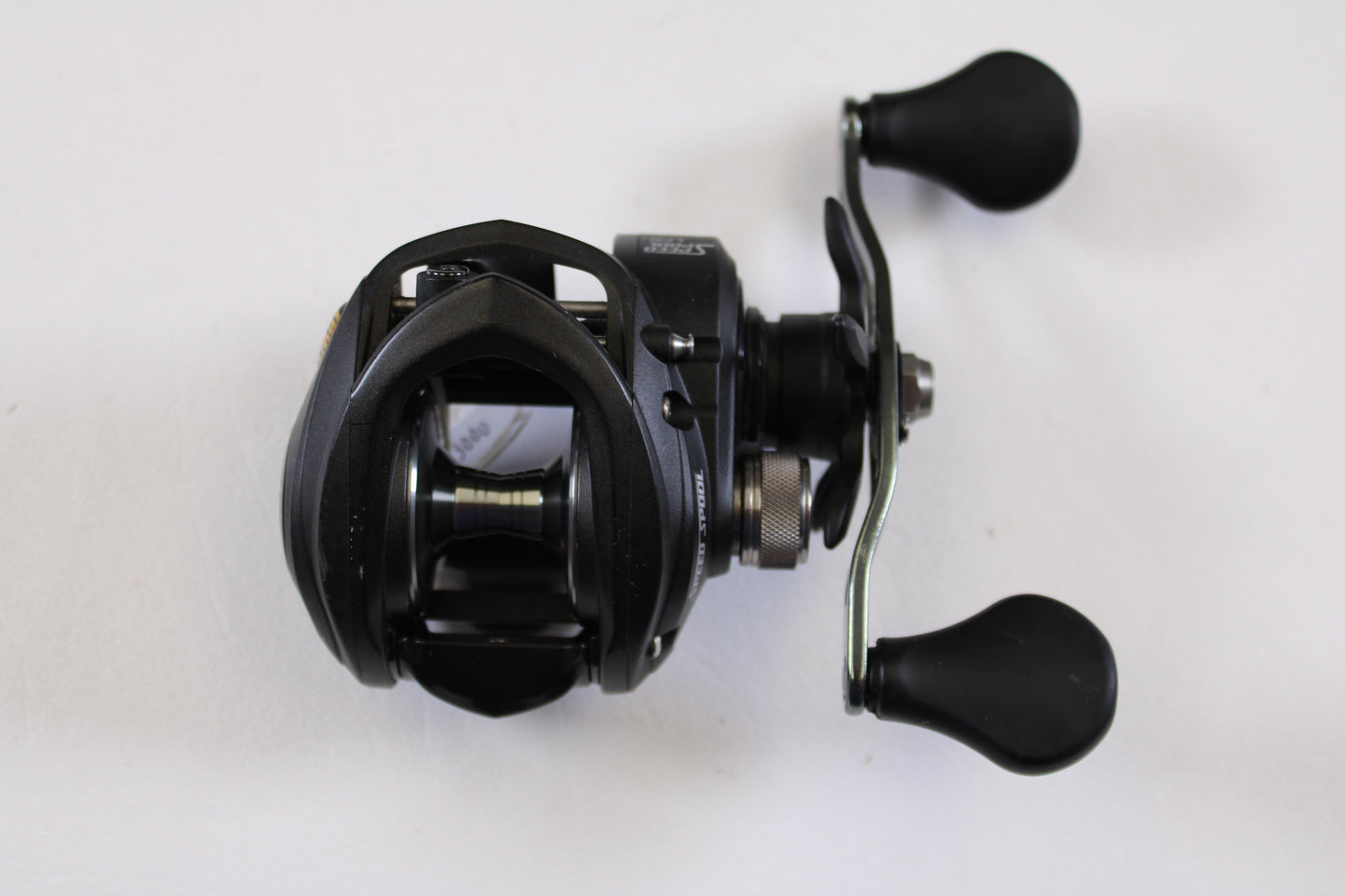 A Lew's Speed Spool SS1SA 5.6:1 RH Used Casting Reel in very good condition is displayed from above on a white background—an ideal choice for the Rod and Reel Trade-In Program if you're upgrading your fishing gear.
