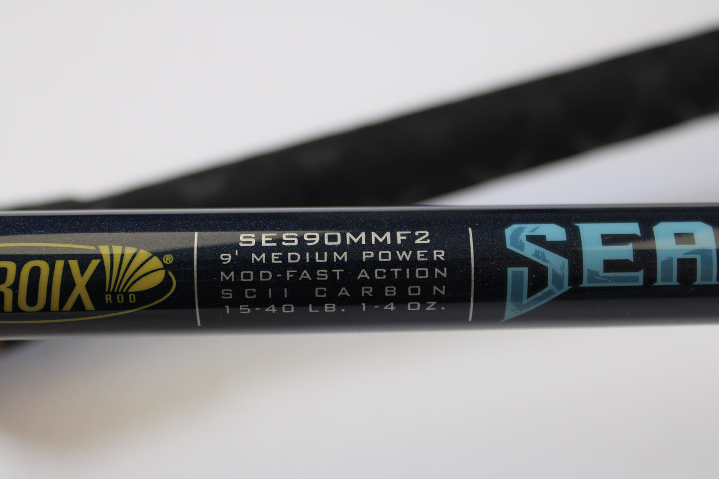 Close-up of a St. Croix Seage SES90MMF2 9'0" Medium 2-Piece Spinning Rod in excellent used condition, logo partially visible—ideal for our Rod and Reel Trade-In Program if you want store credit or quality used gear.