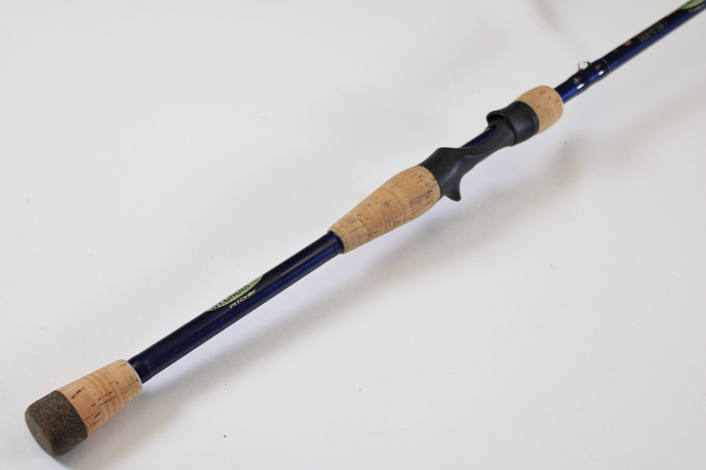 A close-up of the St. Croix Legend Tournament LBC75HMF 7'5" Heavy Casting Rod in excellent used condition, featuring a blue shaft, cork handle grips, and a black reel seat—ideal for those interested in our rod and reel trade-in for store credit.