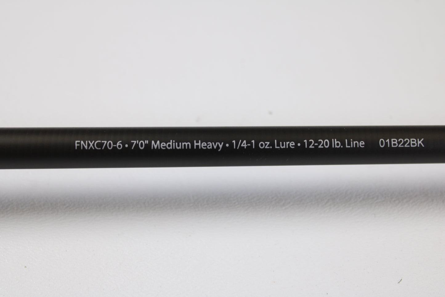 A close-up of the Abu Garcia Fantasista FNXC70-6 7'0" Medium Heavy Used Casting Rod in excellent condition, shown against a white background, perfect for upgrading your gear or trading in your current rod and reel.
