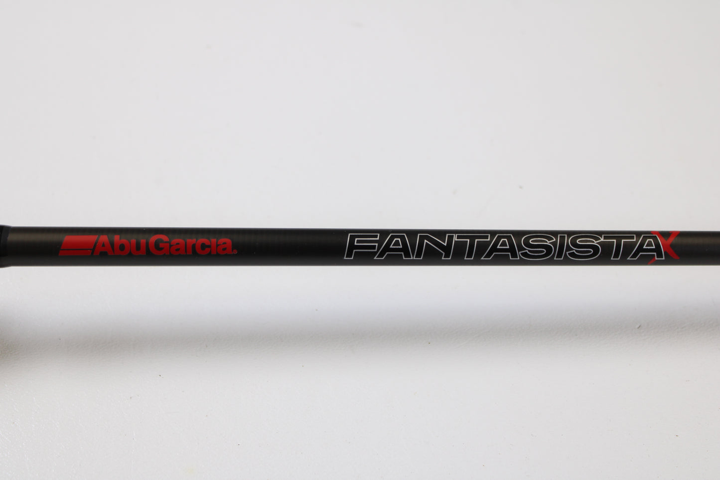 A close-up of the Abu Garcia Fantasista FNXC70-6 7'0" Medium Heavy Used Casting Rod in excellent condition, featuring the bold red "Abu Garcia" logo—ideal for anglers interested in quality pre-owned gear.