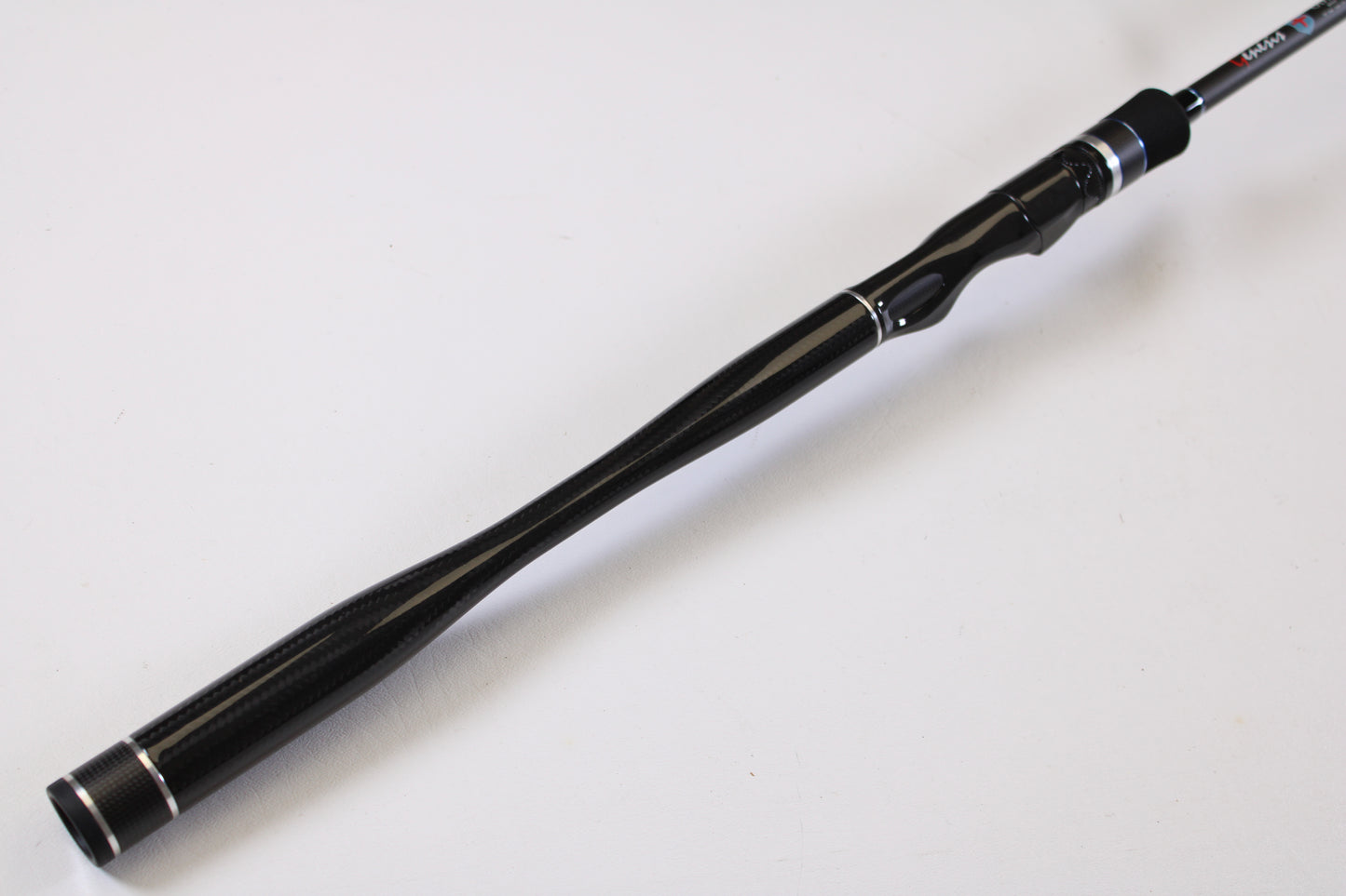 A close-up of the ODM Rods Genesis Inshore BXGX 761MS 7'6" Medium Used Spinning Rod handle, featuring an ergonomic grip, ideal for our rod and reel trade-in program, shown against a plain white background.