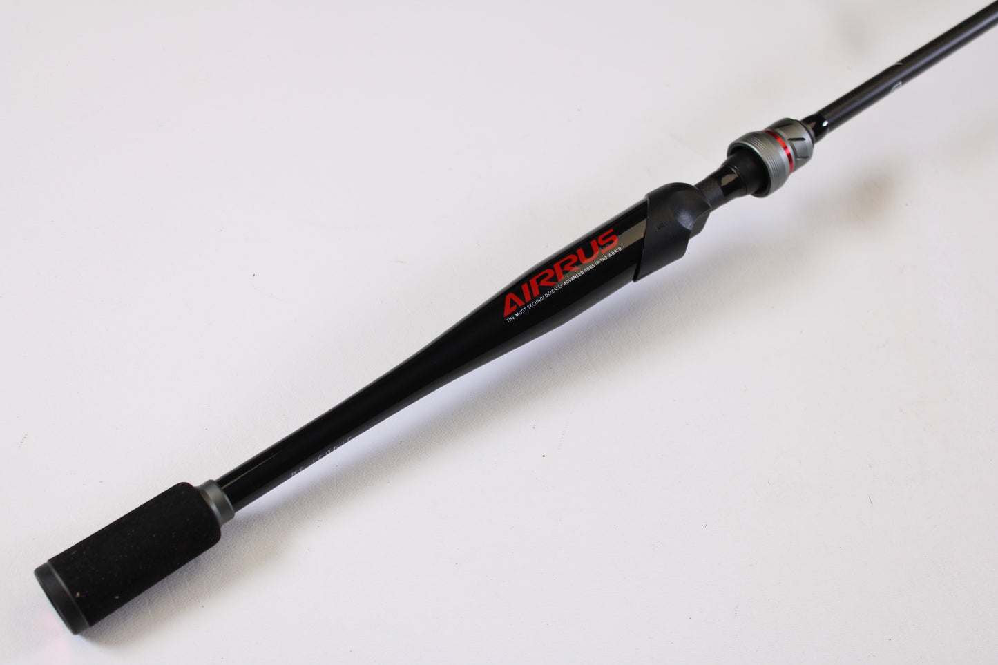 A close-up of the Airrus Stargate ASG681LF-S 6'8" Light used spinning rod in excellent condition, featuring the "AIRRUS" brand name on the handle, set against a plain white background. Ideal for those seeking quality pre-owned gear.