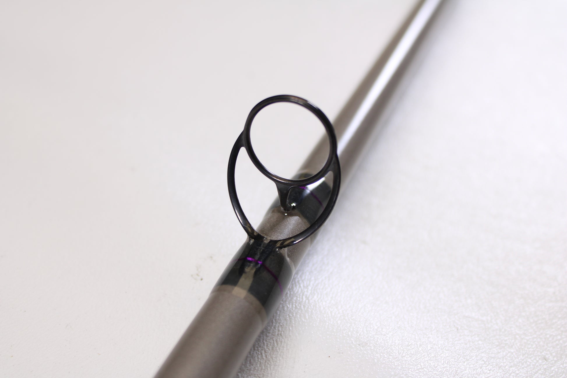 Close-up of a St. Croix Mojo Musky Trolling MMT70XHM 7'0" XH Used Casting Rod in mint condition, shown on a white surface—great for upgrading via our Rod and Reel Trade-In Program and earning store credit for your used gear.