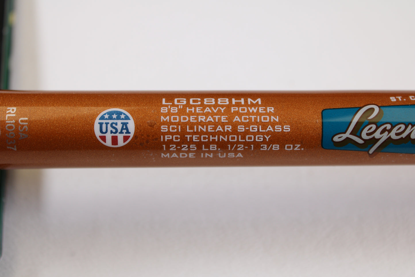 Close-up of a St. Croix Legend Glass LGC88HM 8'8" Heavy Used Casting Rod (Mint Condition) with USA flag emblem—ideal for our rod and reel trade-in program.
