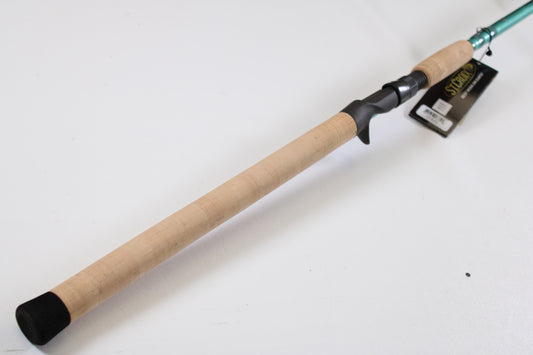 A close-up of the St. Croix Avid Inshore VIC80HF 8'0" Heavy casting rod handle, featuring a cork grip and black reel seat—ideal for those seeking top-quality used rods or participating in our trade-in program.