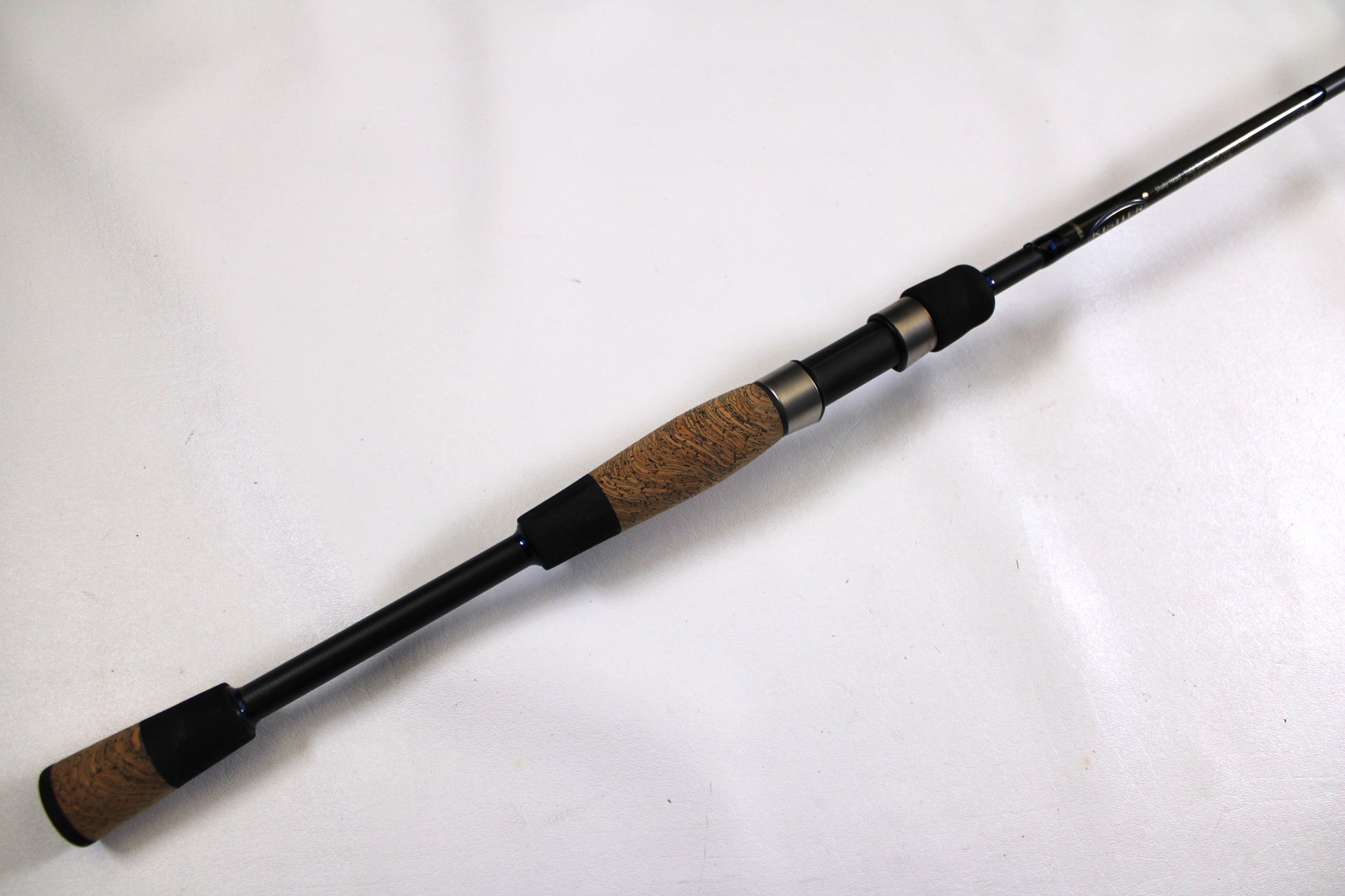 The Kistler Helium MIC-HESHTB70MHS 7'0" Medium Heavy Used Spinning Rod, in excellent condition, is ideal for upgrading your fishing gear or trading in through the Rod and Reel Trade-In Program.